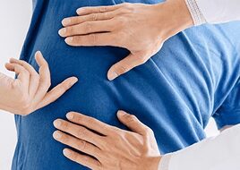 Chiropractor treating patient back pain