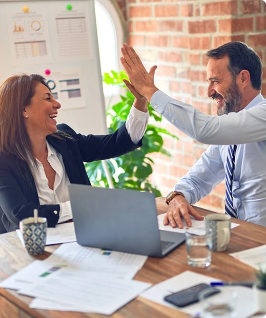 Business partners celebrating successful outcome