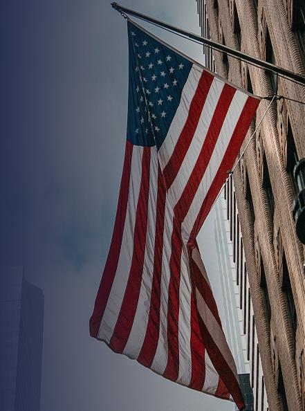 American flag waving outside building