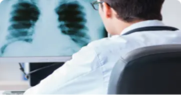 Doctor reviewing patient X-ray scan