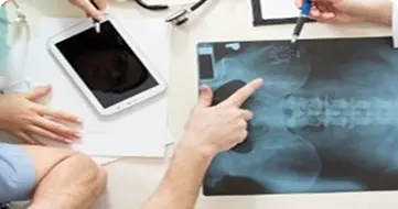 Doctors reviewing X-ray scan