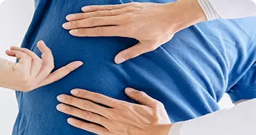 Chiropractor treating patient back pain