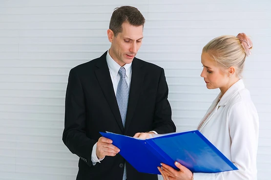 Ged Lawyers reviewing business document folder